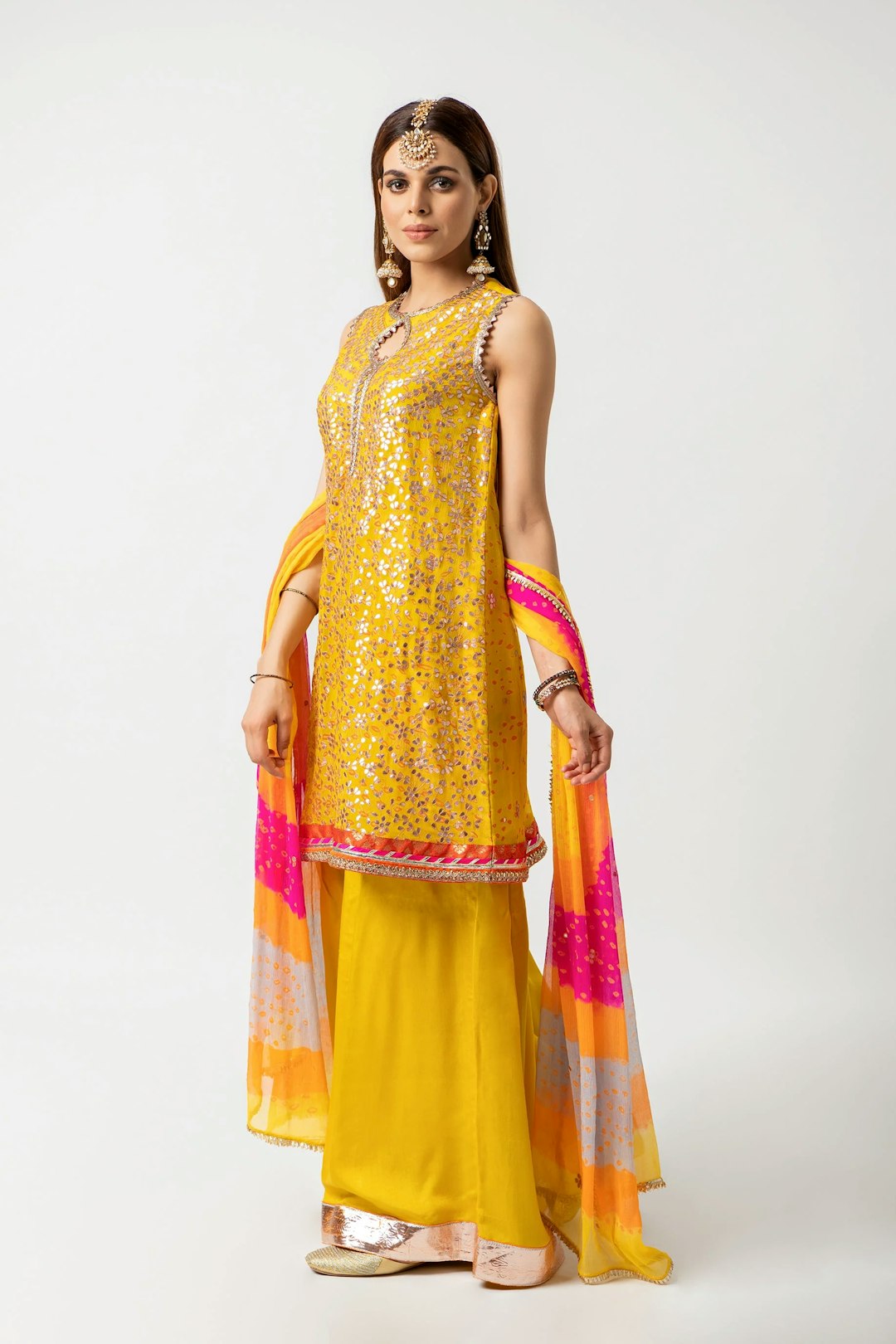Fashion shooting in studio . Professional models , fashionable clothes and style, new collection. stylish look